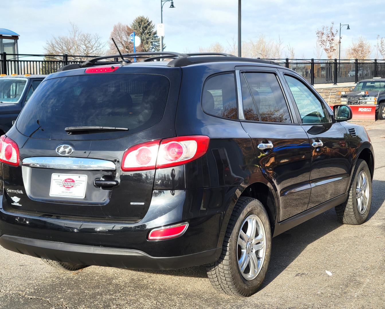 2012 Black /Tan Hyundai Santa Fe Premium (5XYZGDAB1CG) with an 2.4L I4 engine, 8 Speed Automatic transmission, located at 450 N Russell, Missoula, MT, 59801, (406) 543-6600, 46.874496, -114.017433 - NICE AWD SUV. Automatic Transmission. Air. Cruise. Tilt. Power Windows and Locks. AM FM XM Cd Player. Bluetooth. Two Sets of Tires. Studded Snow Tires are currently on. - Photo#5